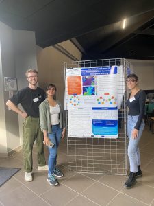 Jamie Mathews, Vinita Desmukh and Mireia Ginesta Fernandez presenting their poster at the workshop